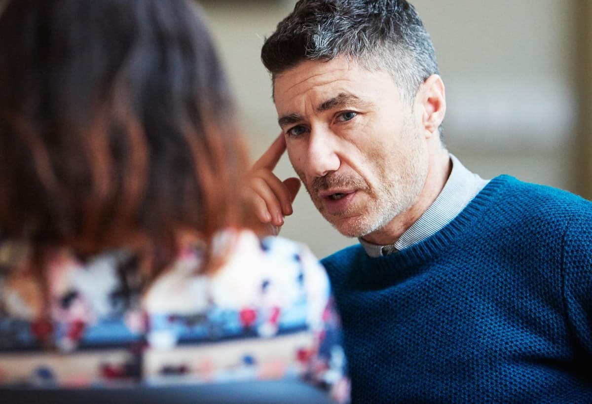 Two people discussing the future of their country